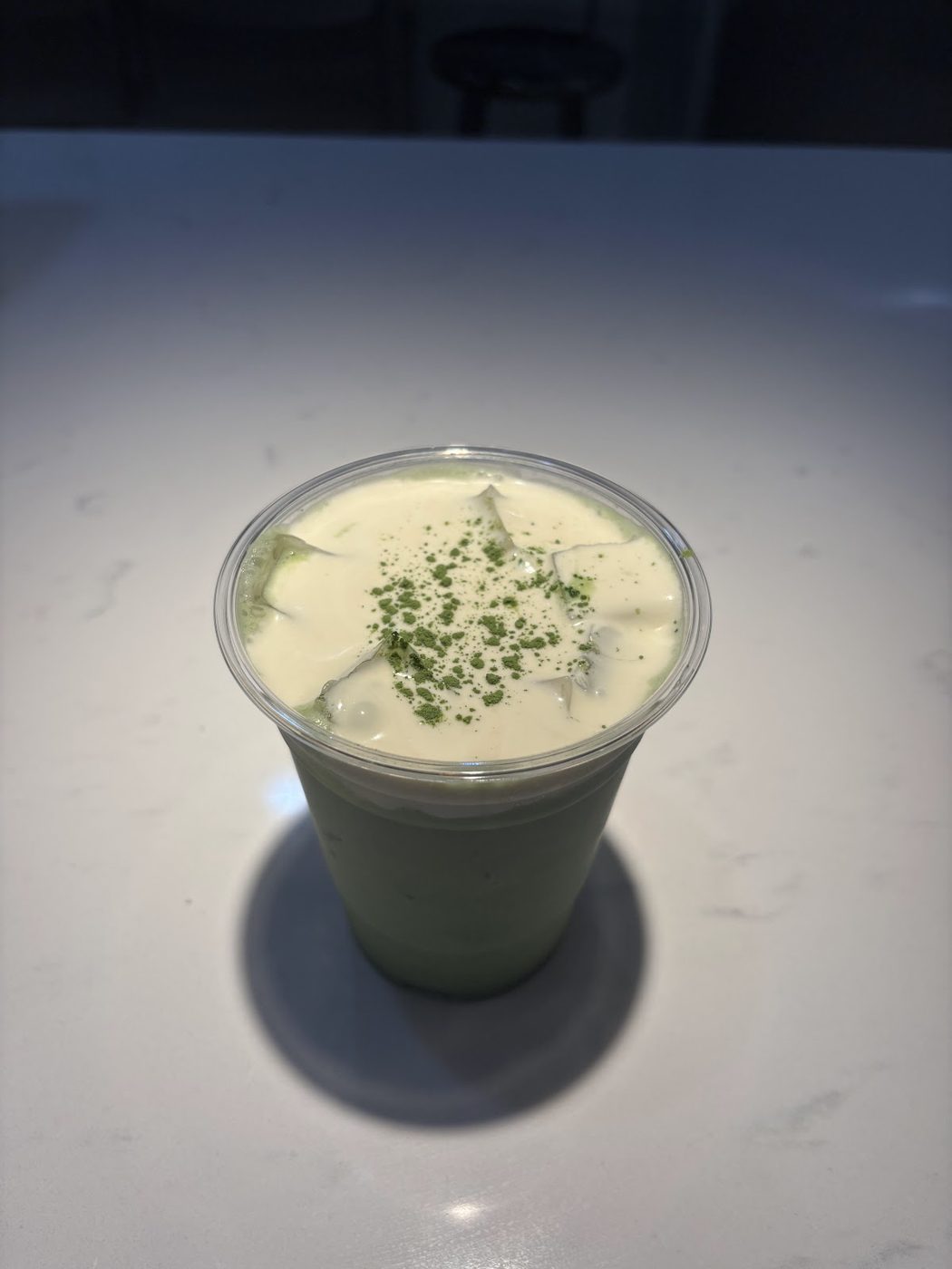 Iced matcha latte with cold foam